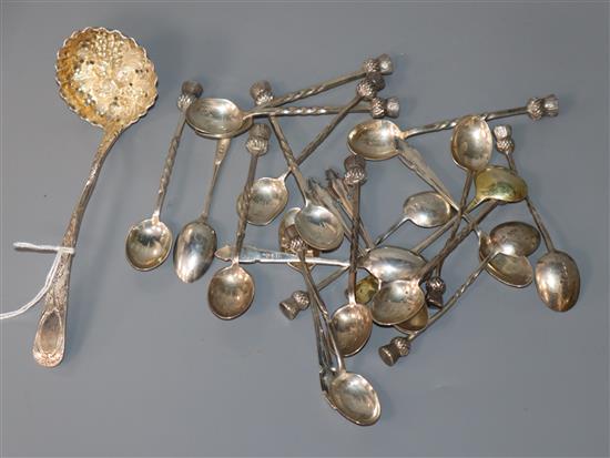 A small collection of silver spoons etc. including thistle end coffee spoons and a sifter spoon.